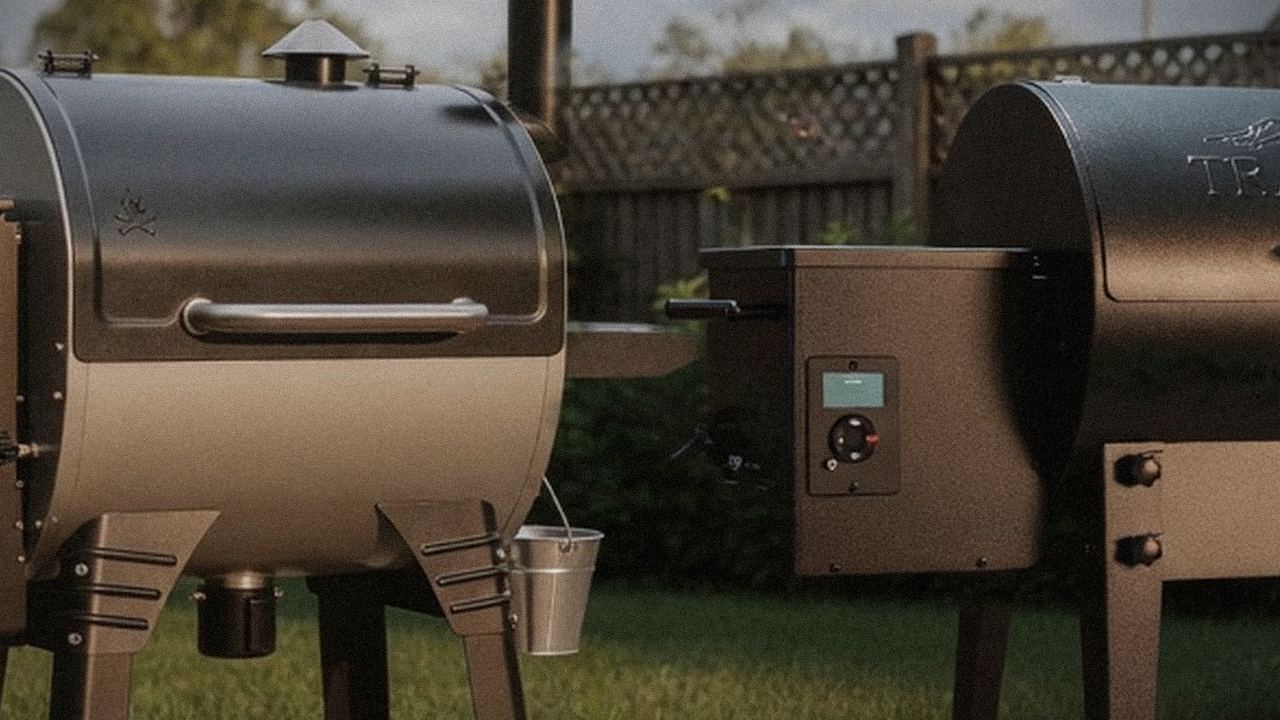 Camp Chef Woodwind Pro WiFi 24 and Traeger Tailgater 20 starting up, controllers lit